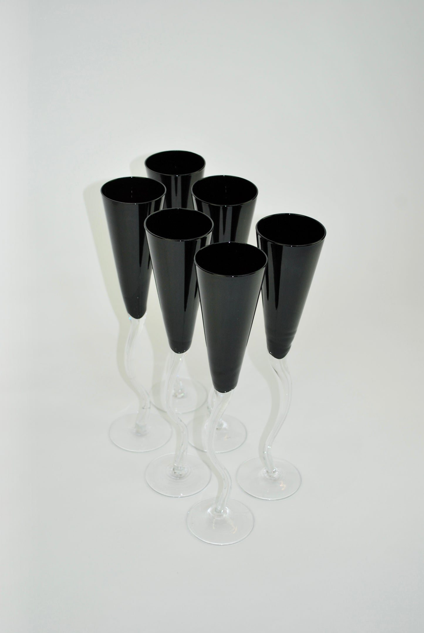 five black dancing flutes