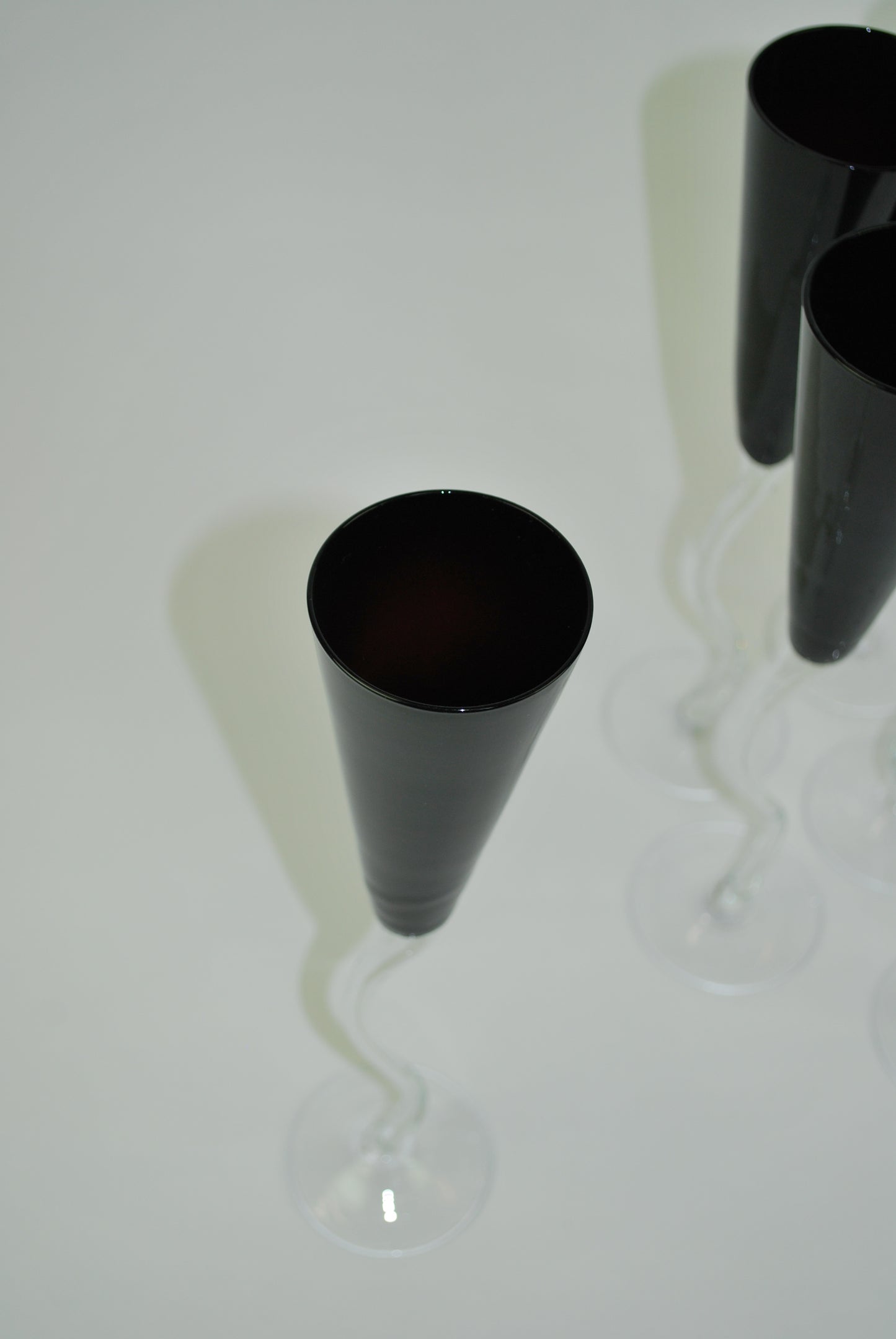 five black dancing flutes