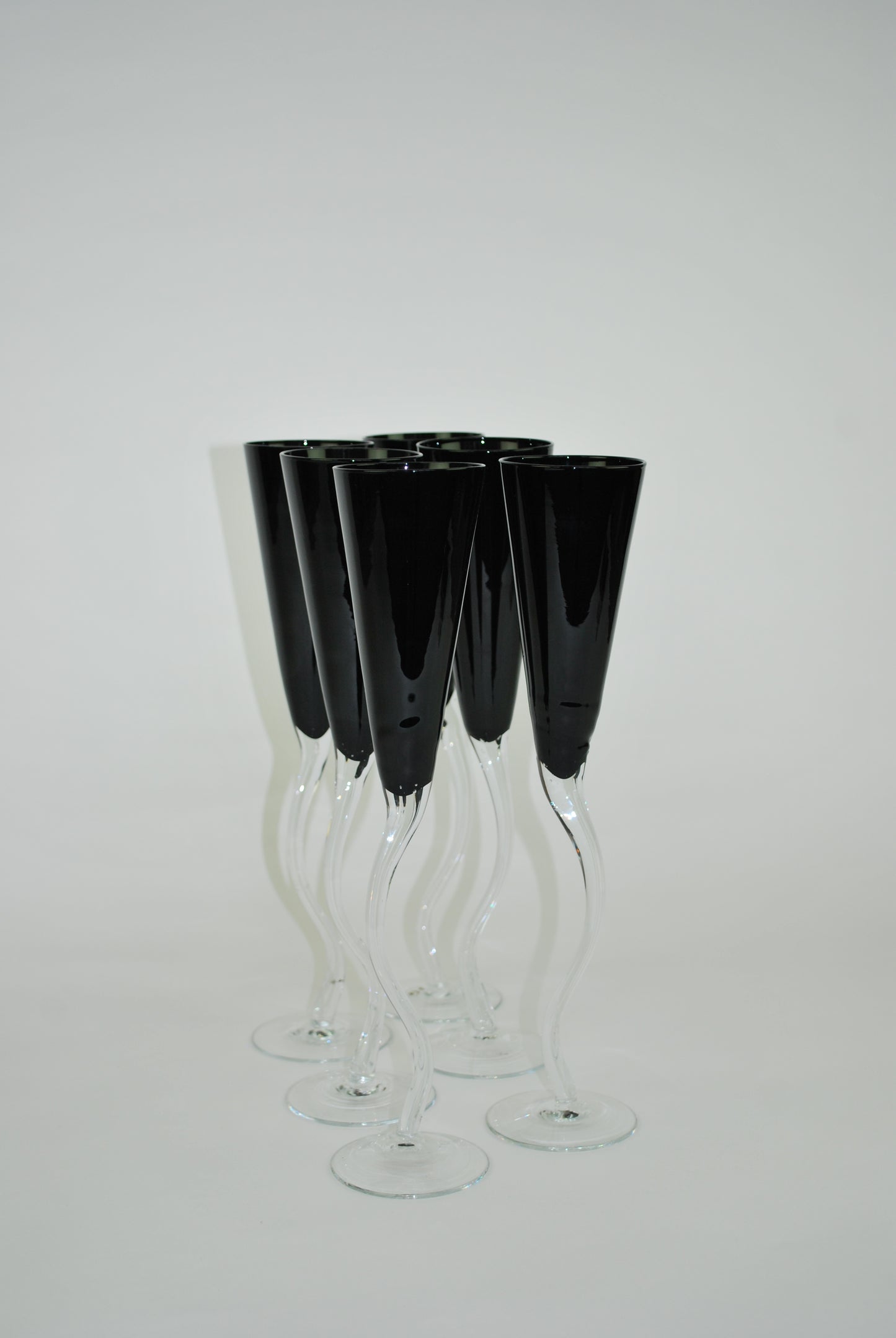 five black dancing flutes