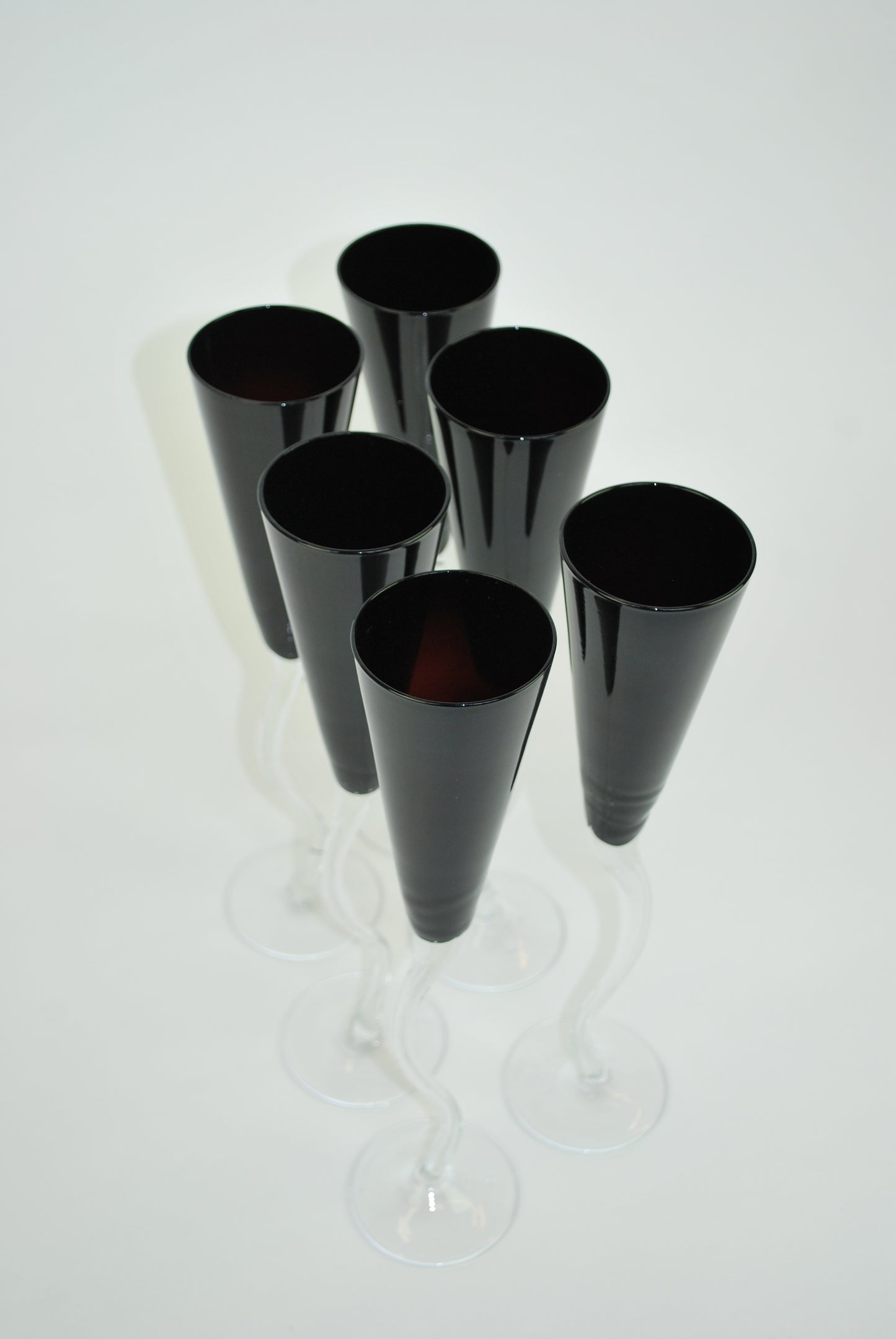 five black dancing flutes