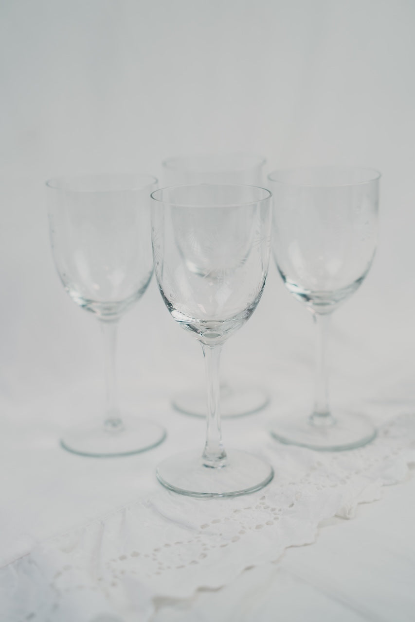 four detailed wineglasses