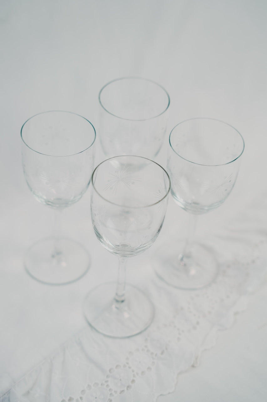 four detailed wineglasses
