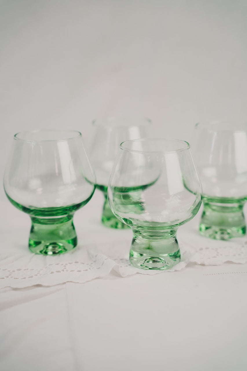 four green cocktailglasses