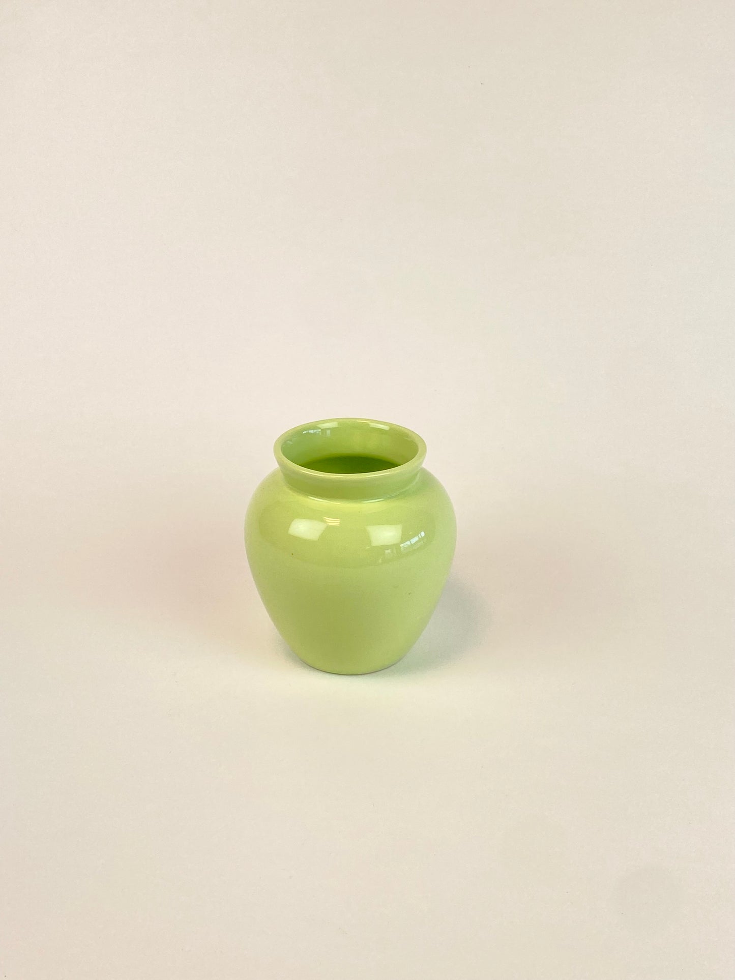 small pastel green vase