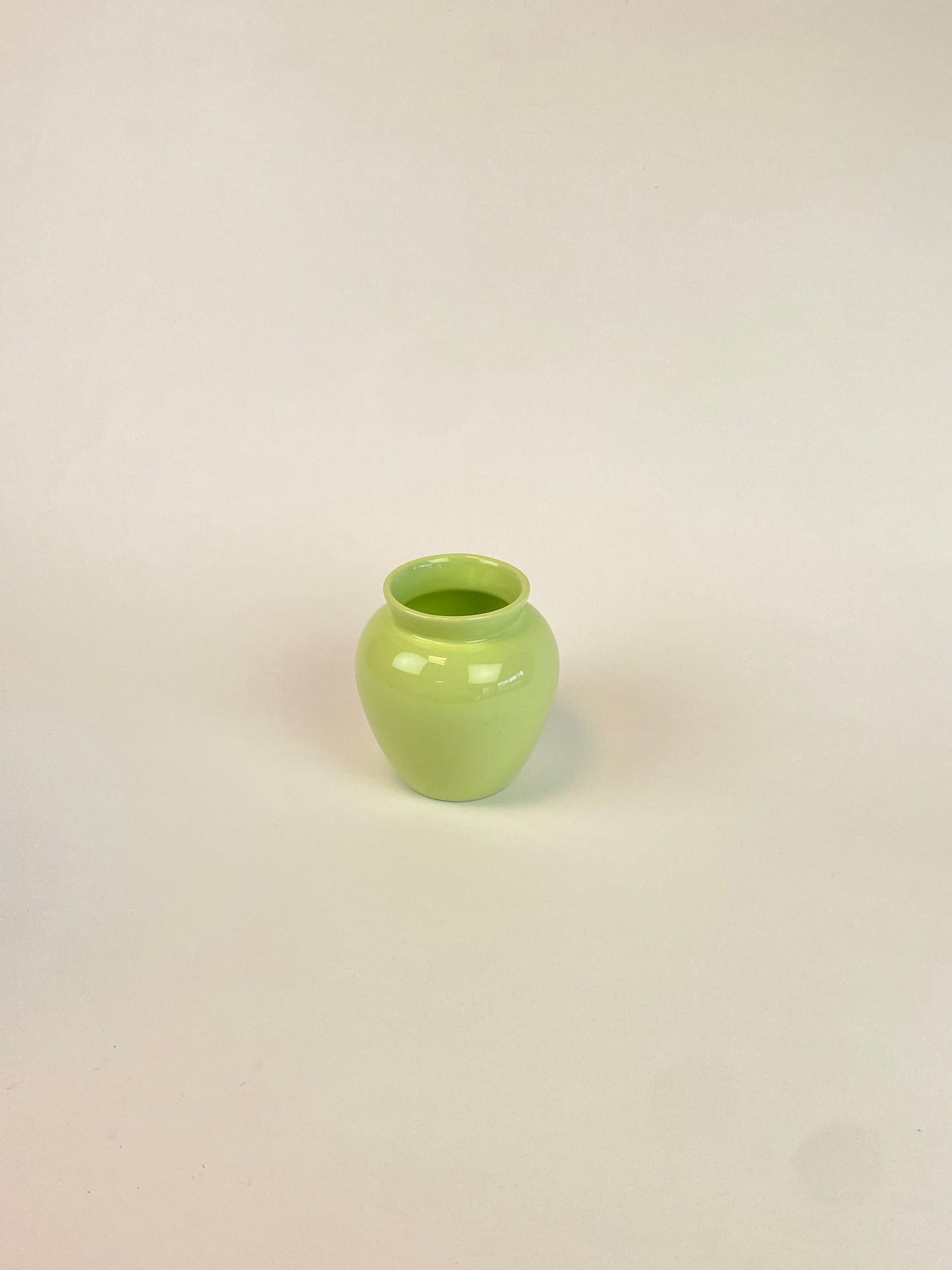 small pastel green vase