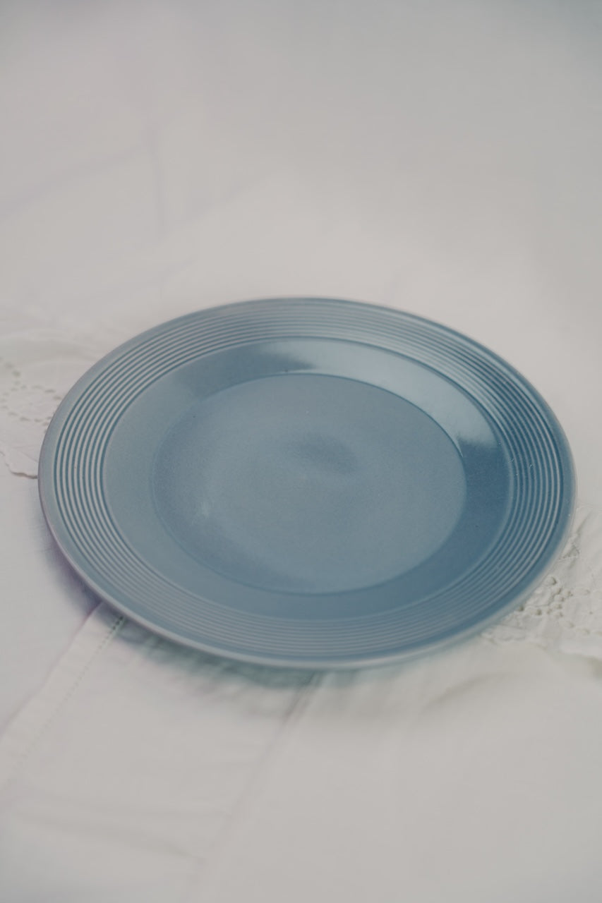 four grey plates