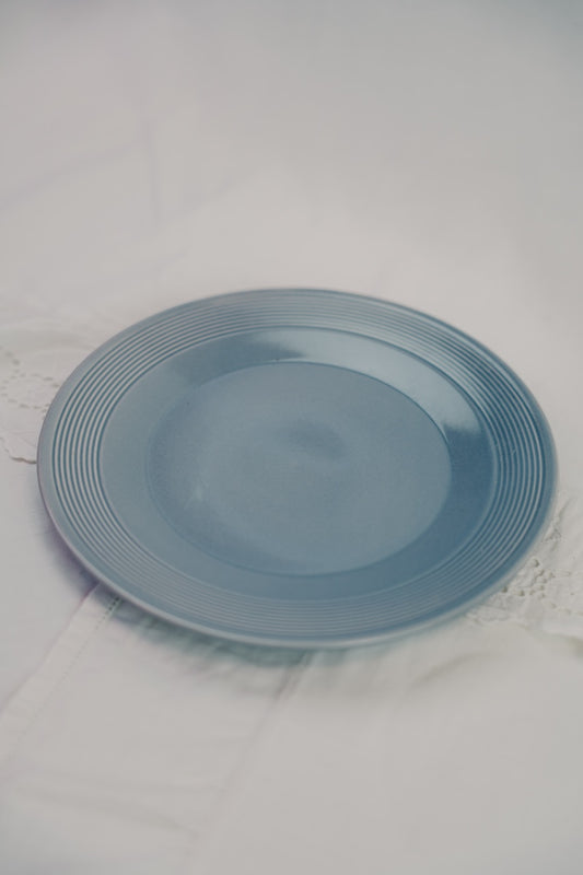 four grey plates