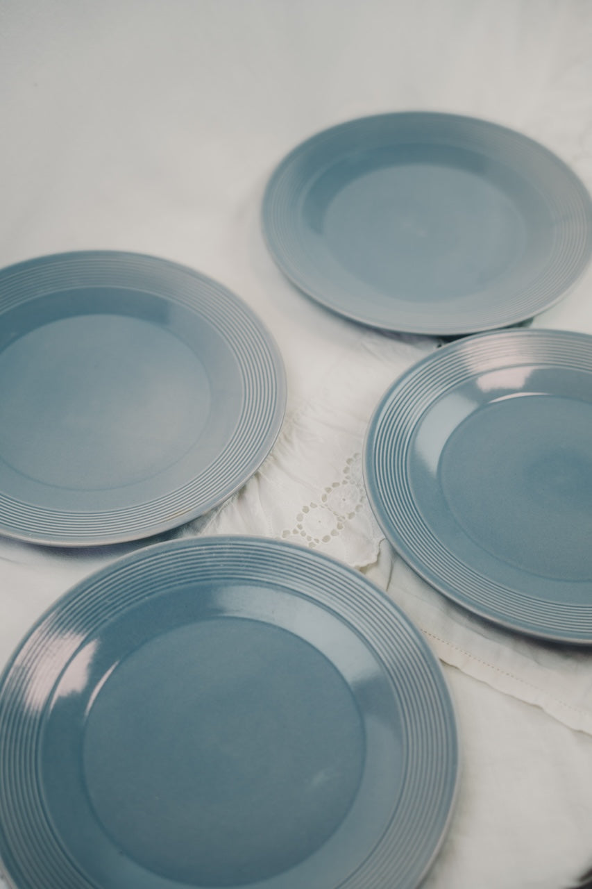 four grey plates