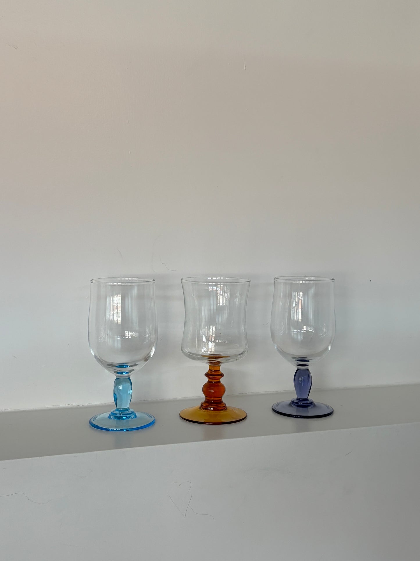 three mixed wineglasses