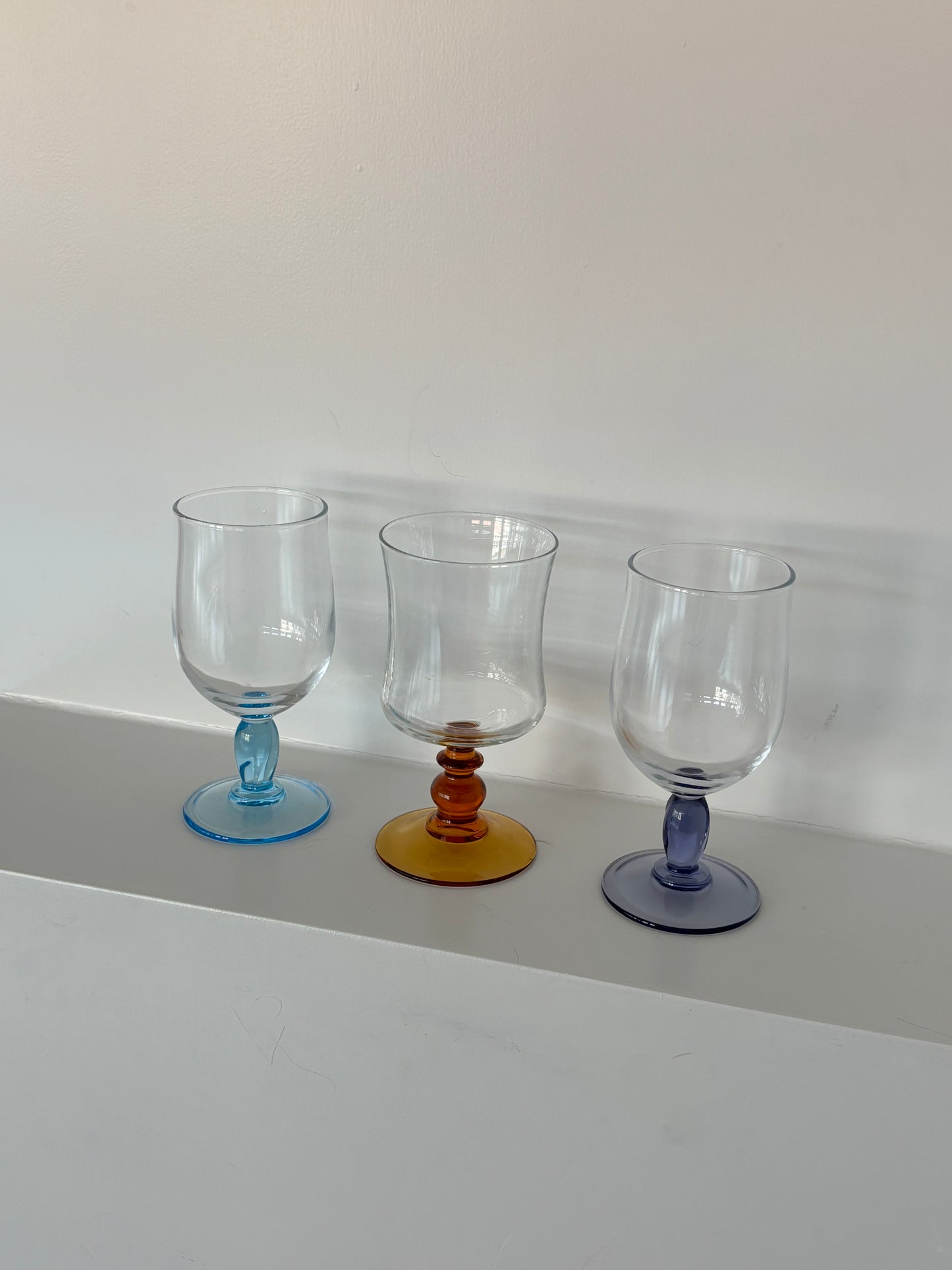 three mixed wineglasses