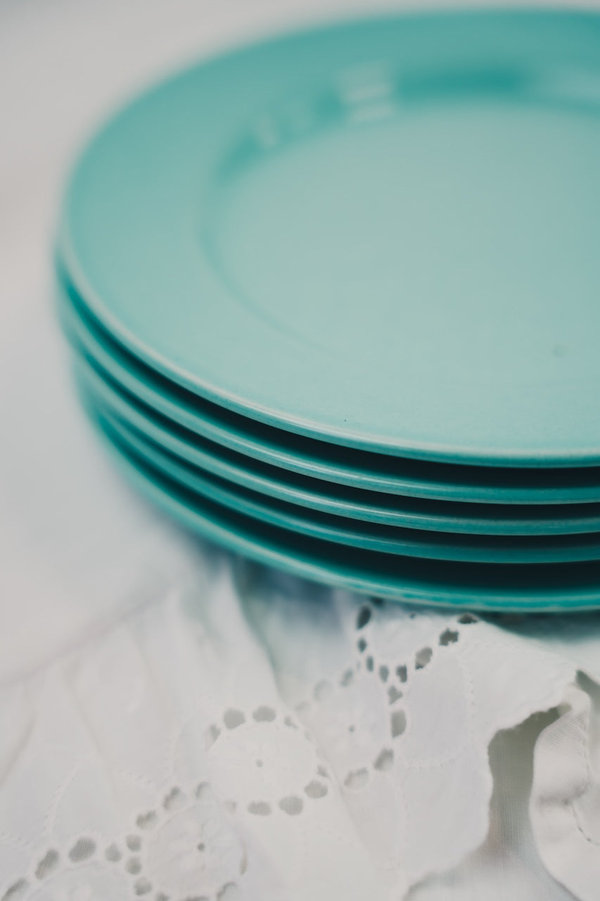 five turquoise plates
