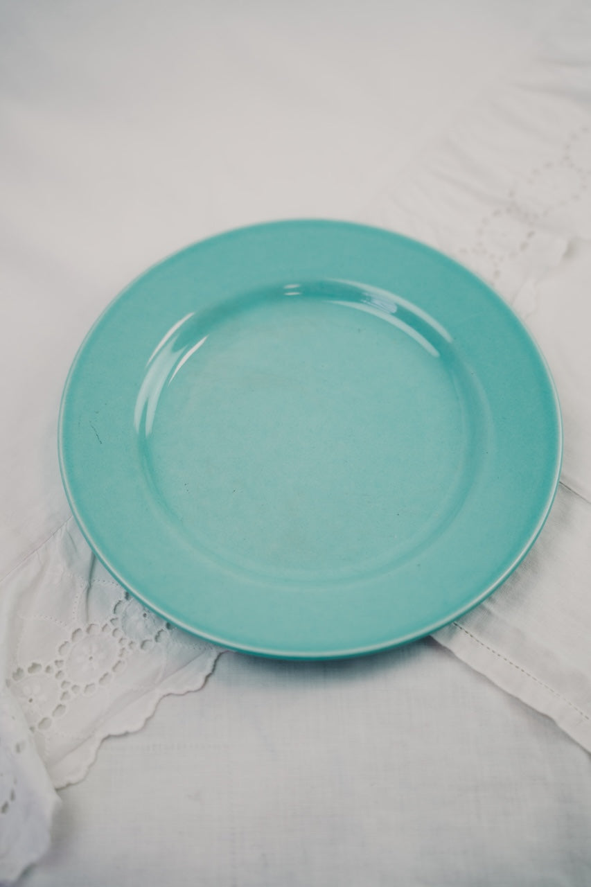 five turquoise plates