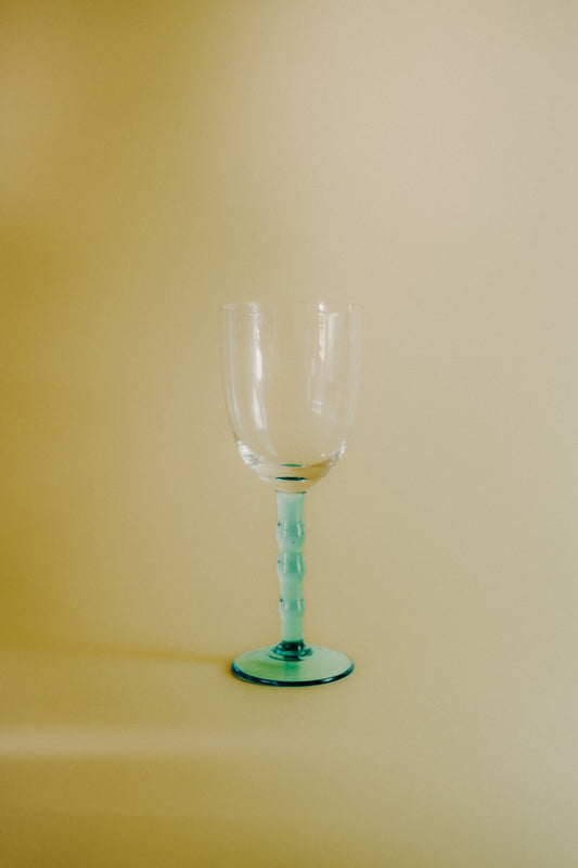 four blue wineglasses