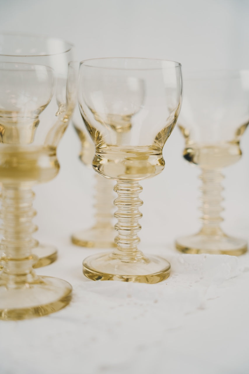 six yellow wineglasses
