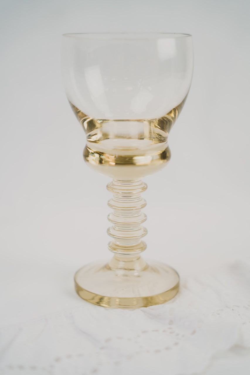six yellow wineglasses