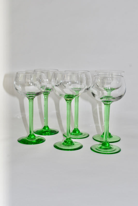 six green French wineglasses