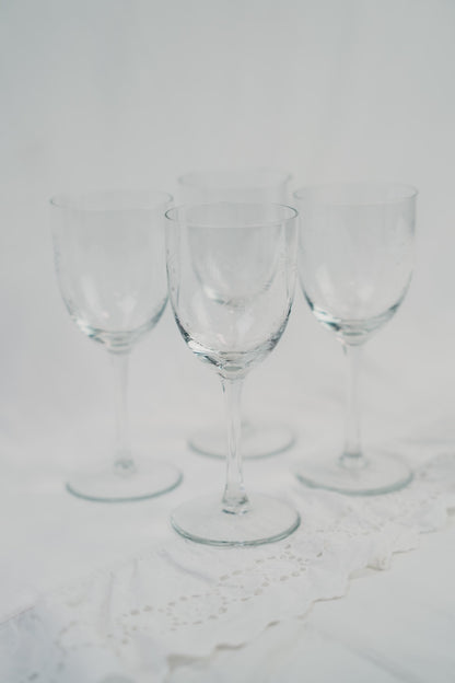 four detailed wineglasses