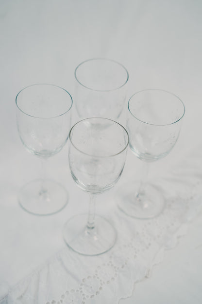 four detailed wineglasses