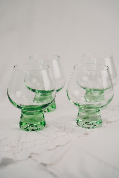 four green cocktailglasses