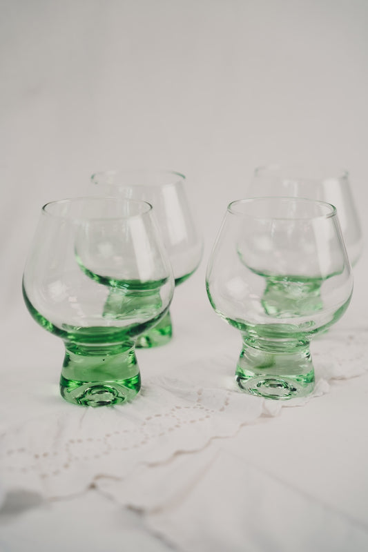 four green cocktailglasses