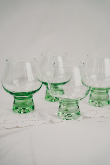 four green cocktailglasses