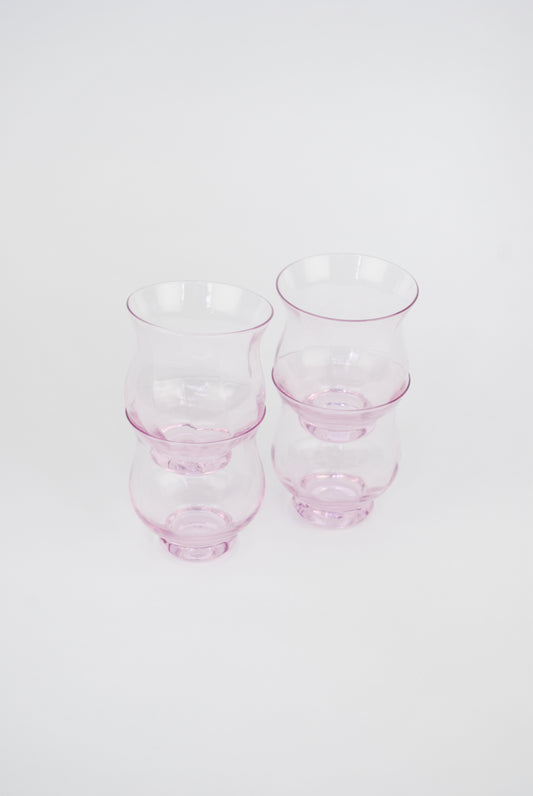 four pink waterglasses