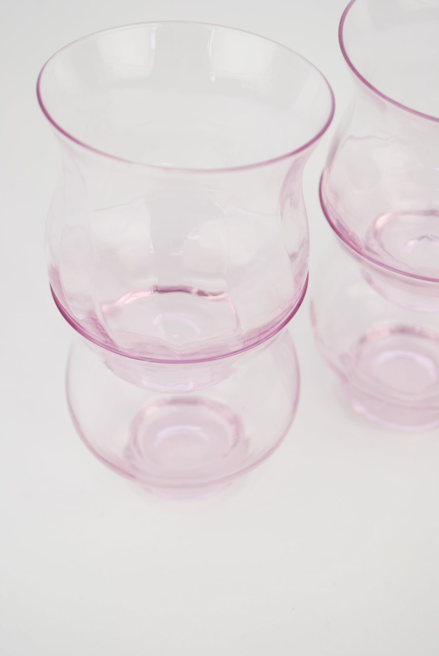 four pink waterglasses