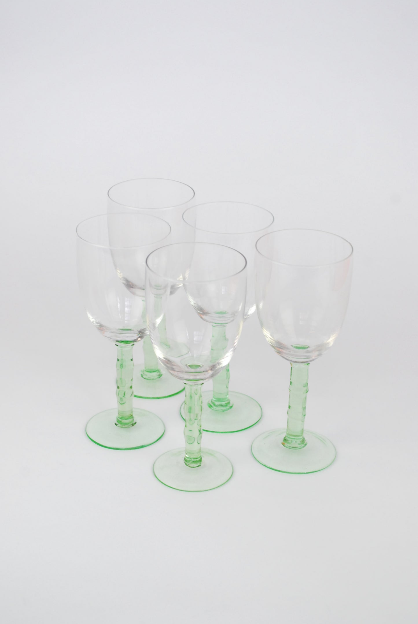 five white wineglasses