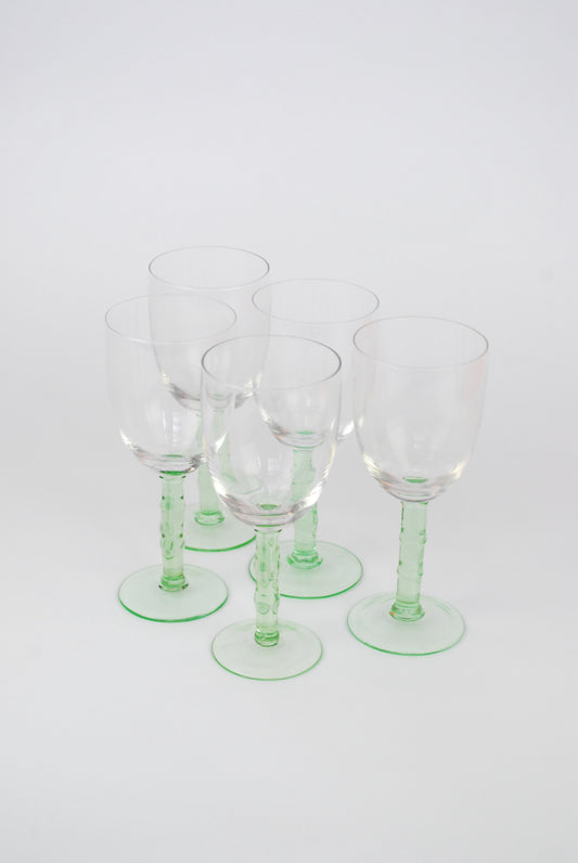 five white wineglasses