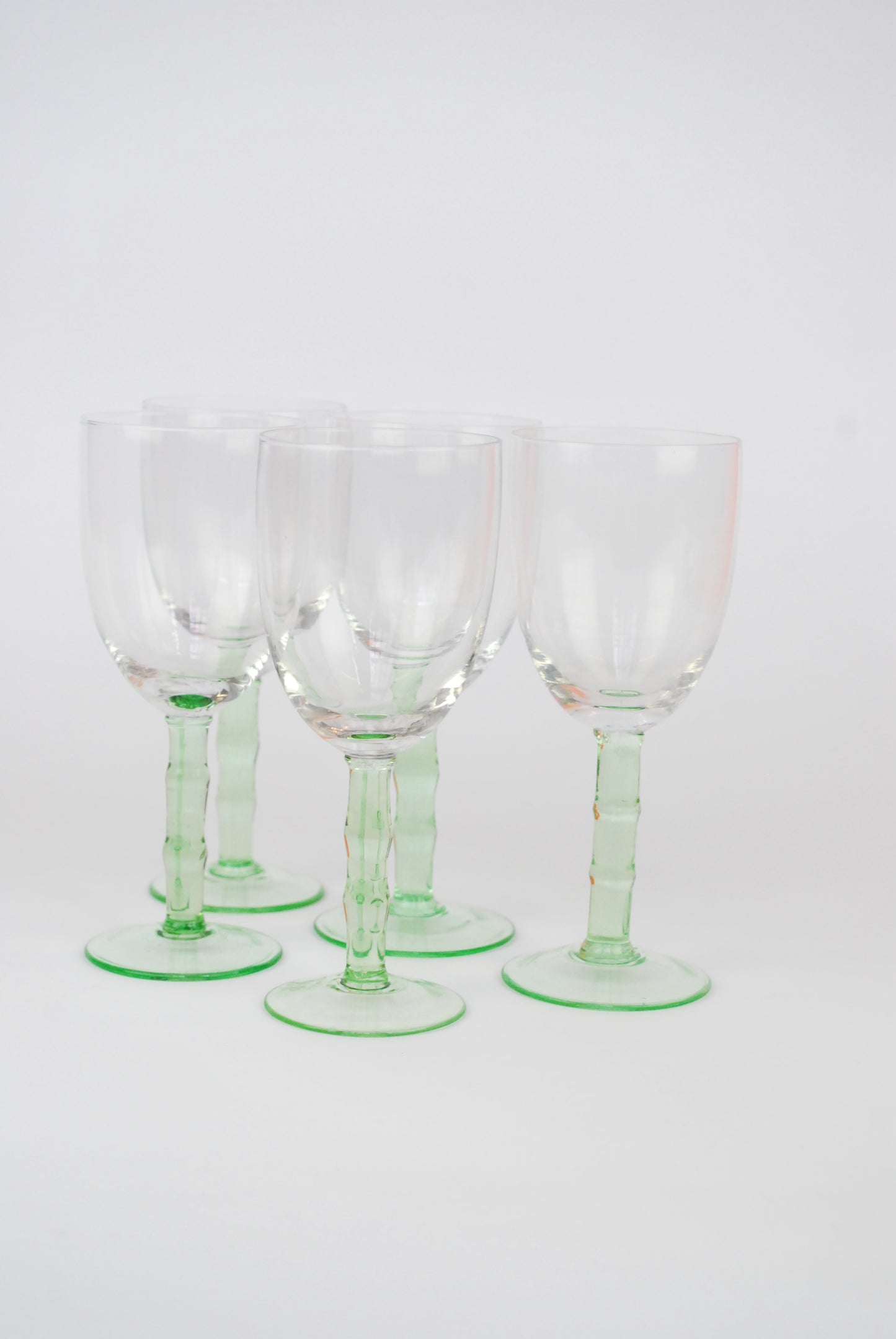 five white wineglasses