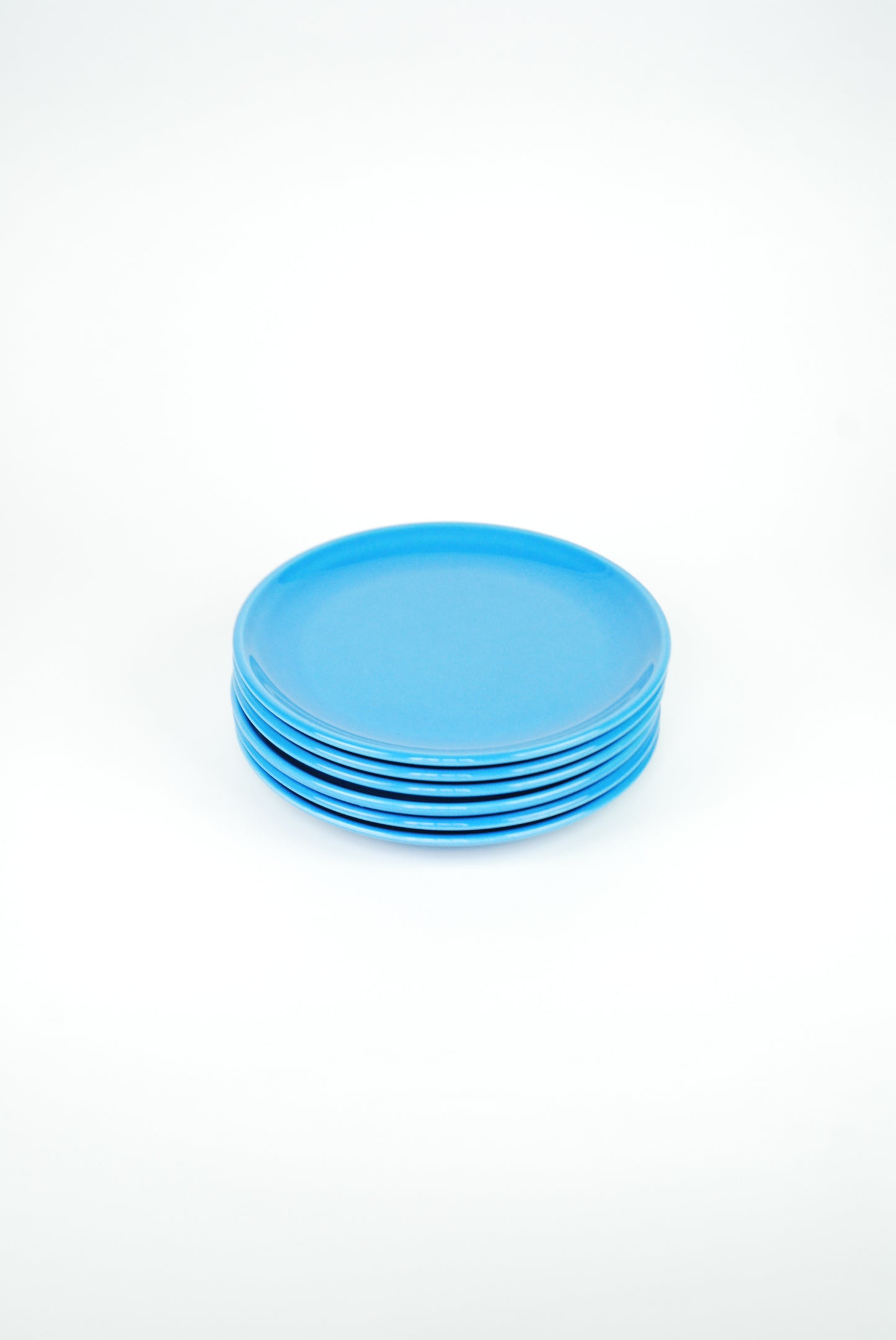 set of six blue plates