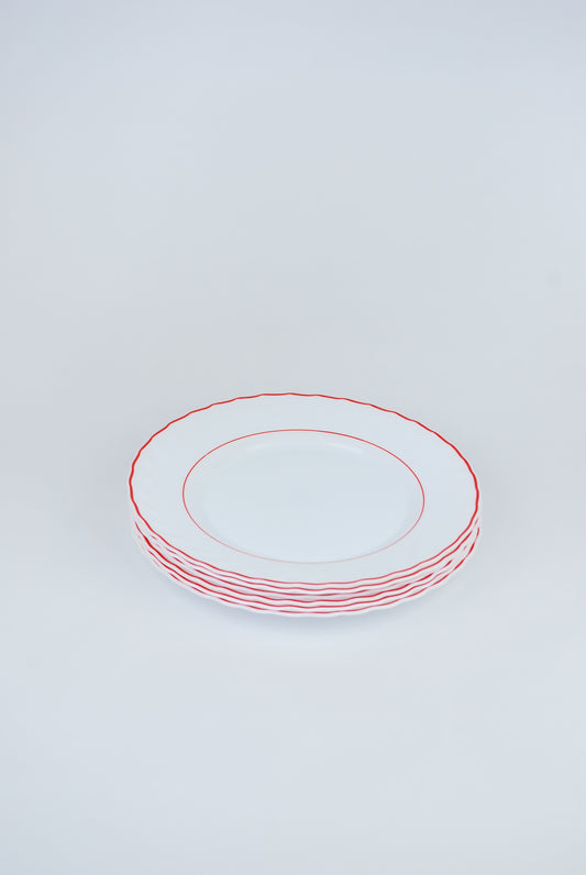 six white plates with red rim