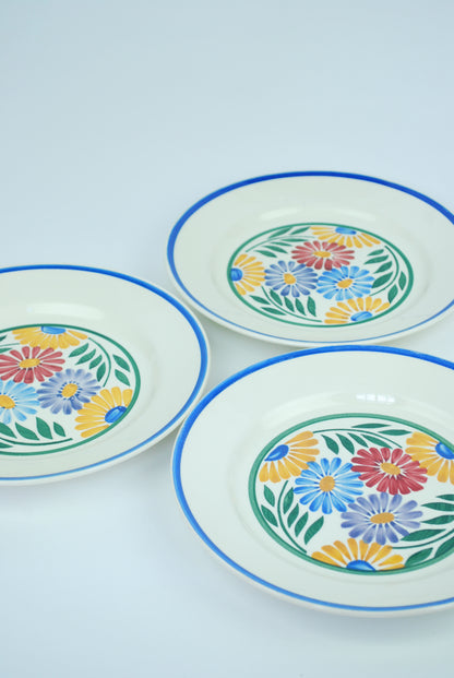 three plates with flowers