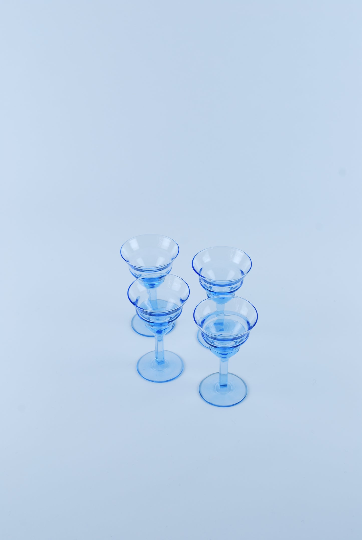 four liquor glasses