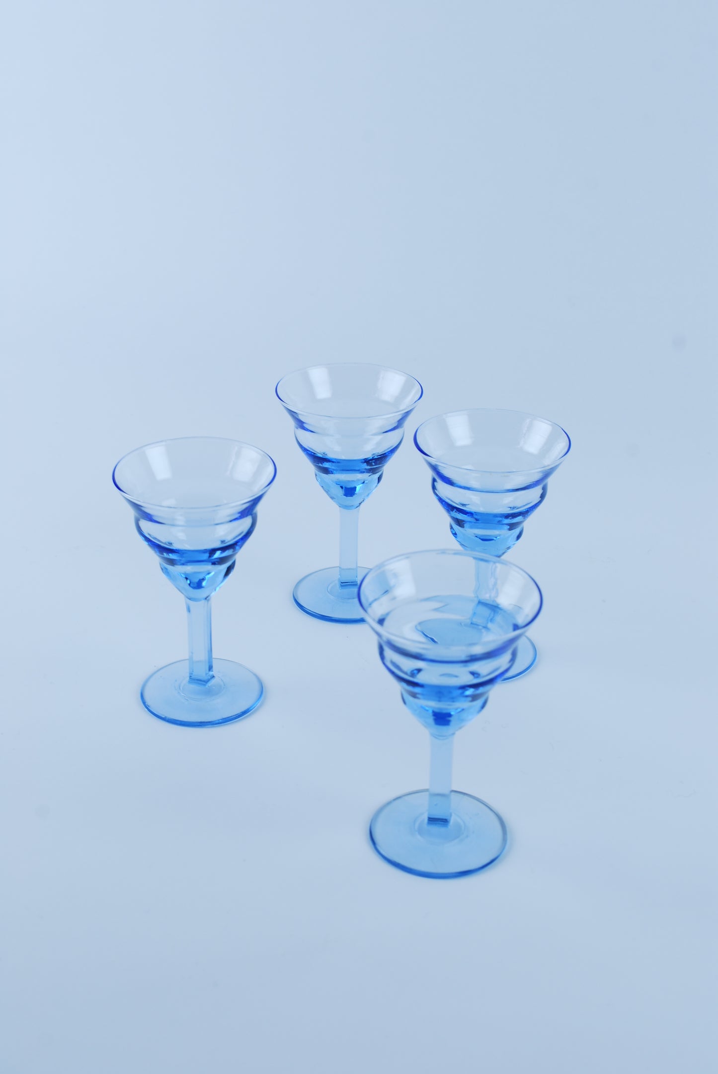 four liquor glasses