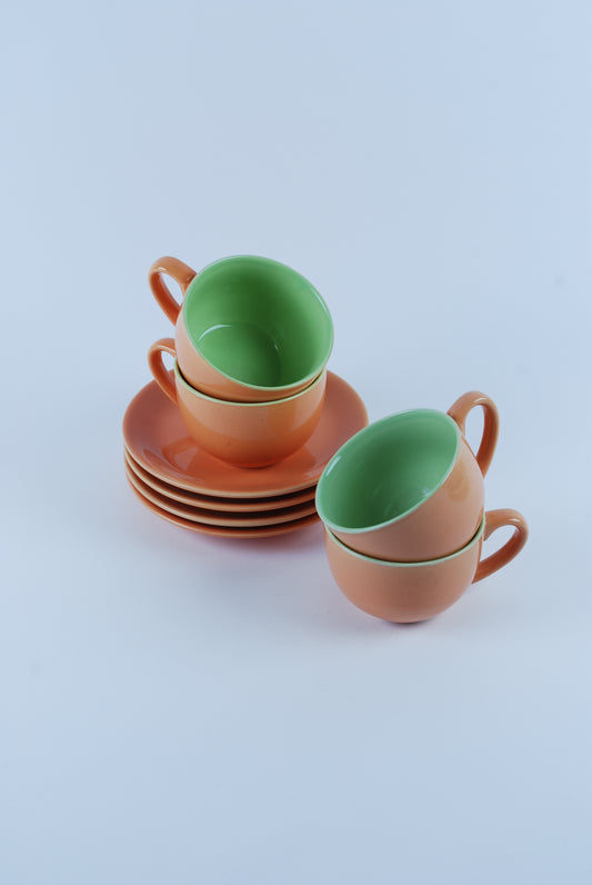 four cappuchino cups and saucers