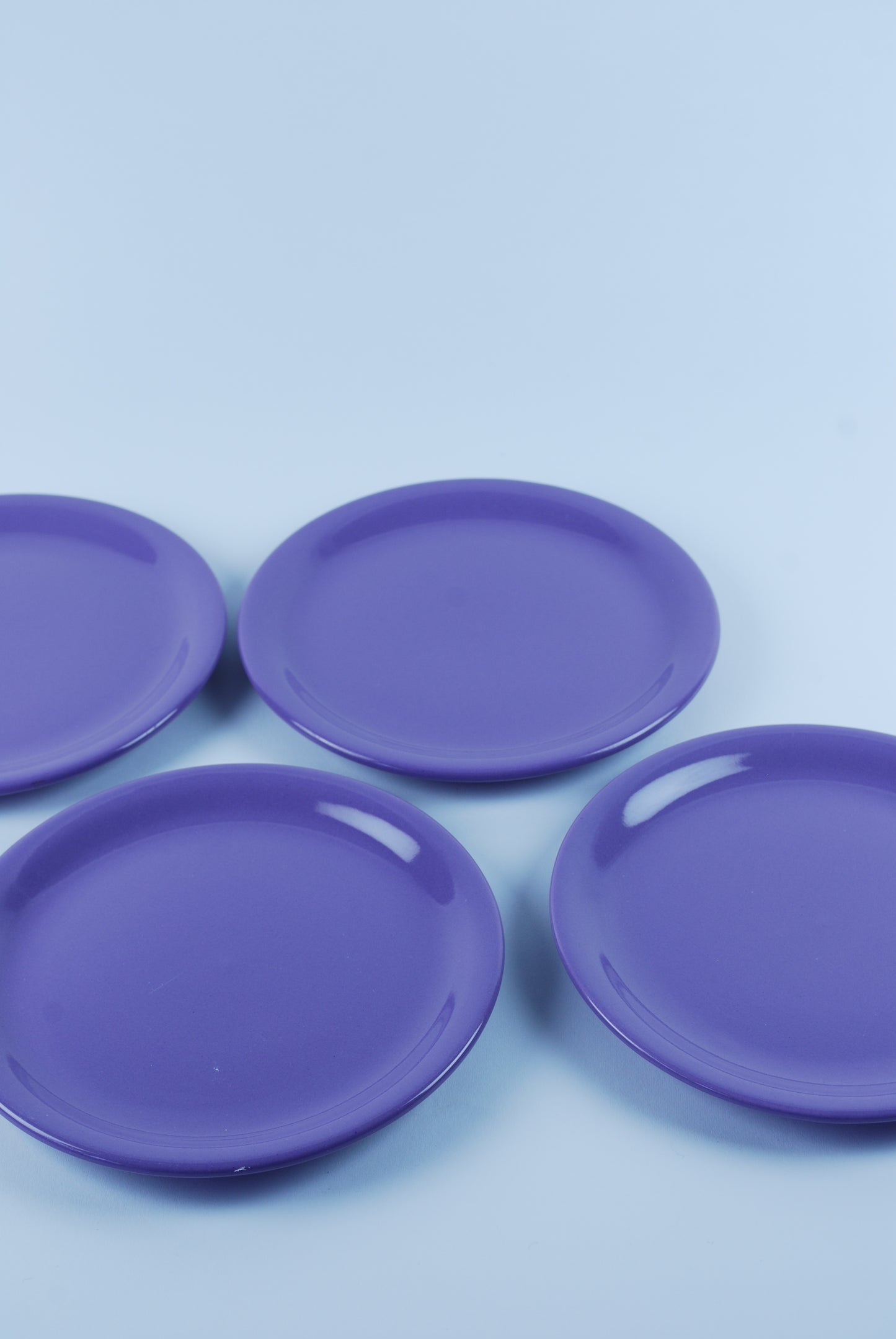 four purple plates