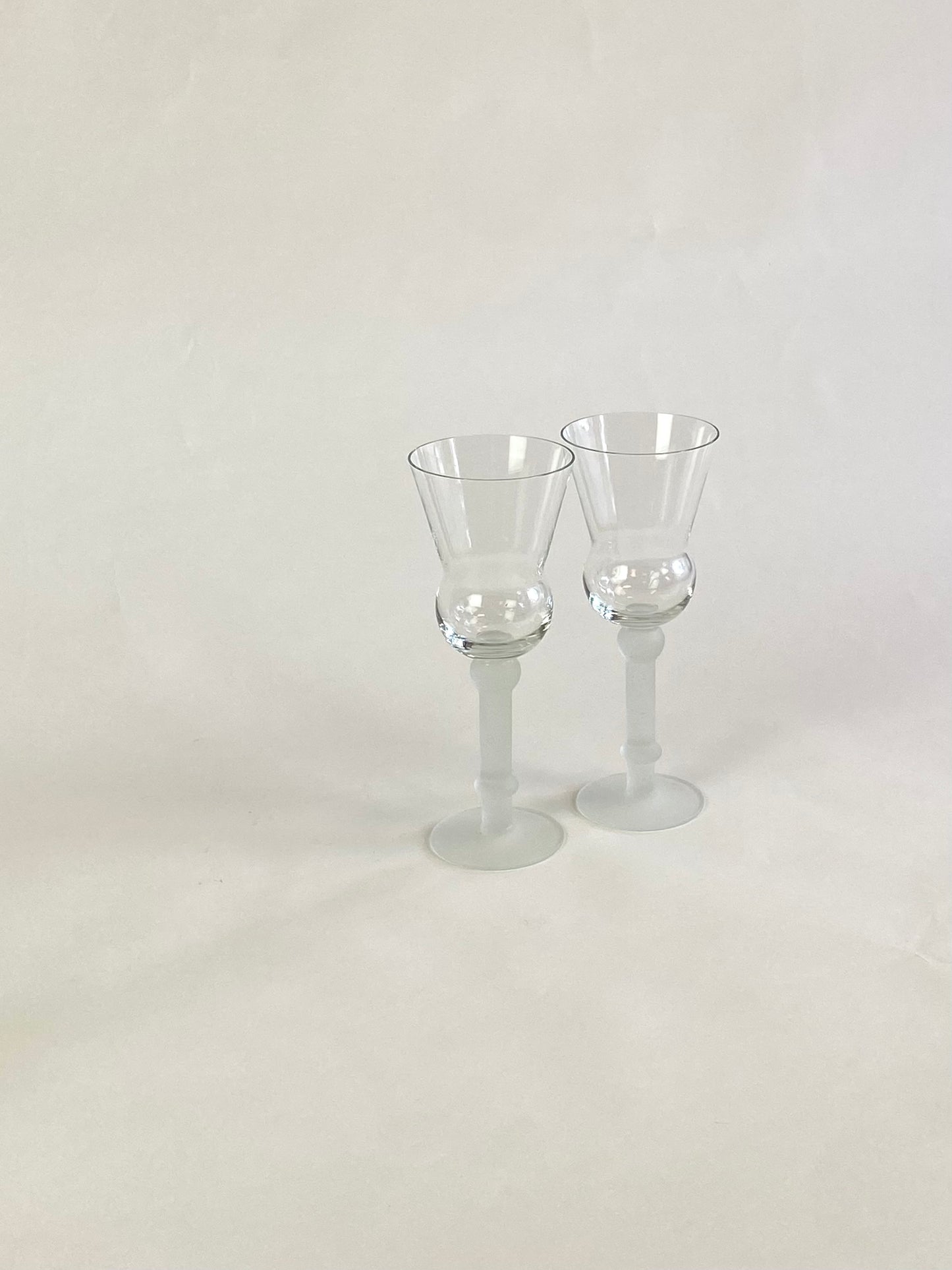 two wineglasses with frosted stem