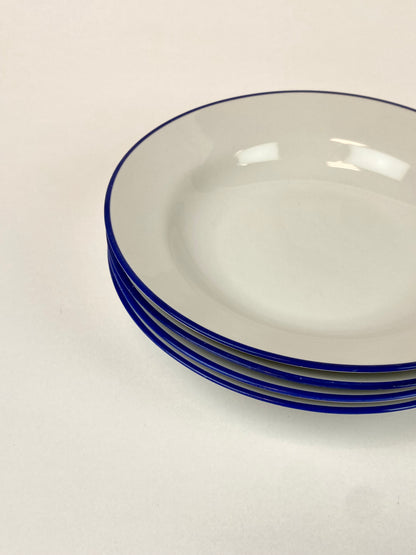 four deep plates with blue edge