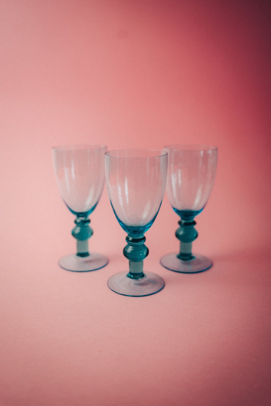 three blue wineglasses
