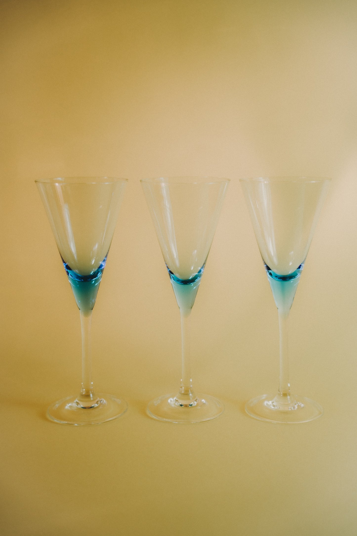 three blue wineglasses