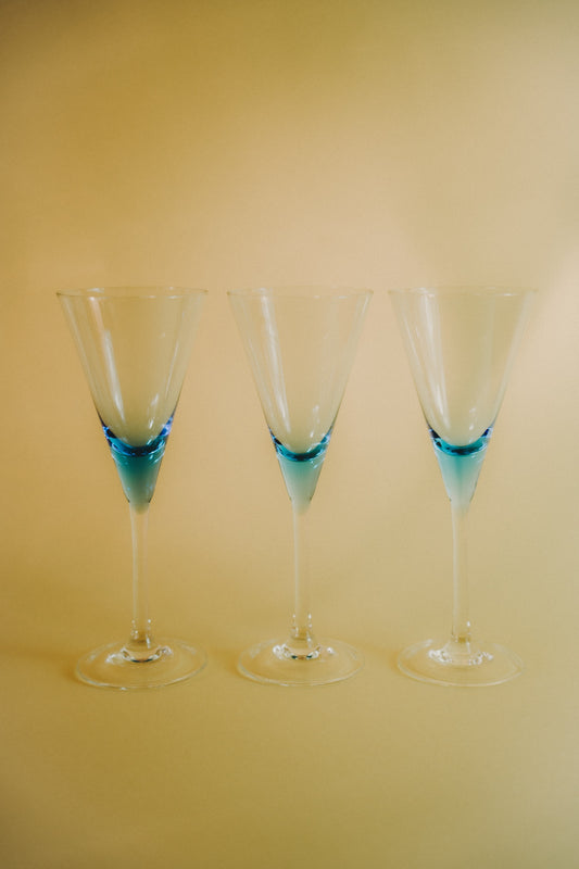three blue wineglasses
