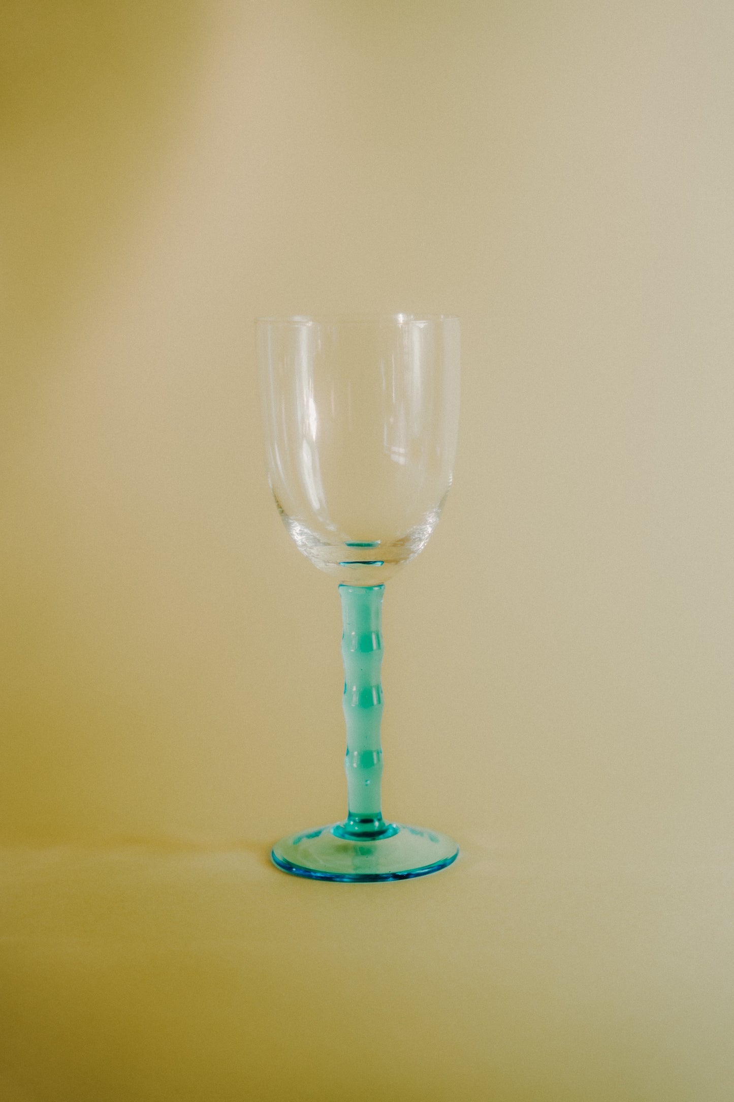 four blue wineglasses