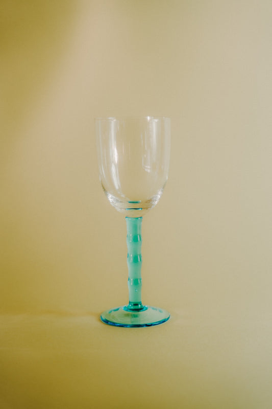 four blue wineglasses