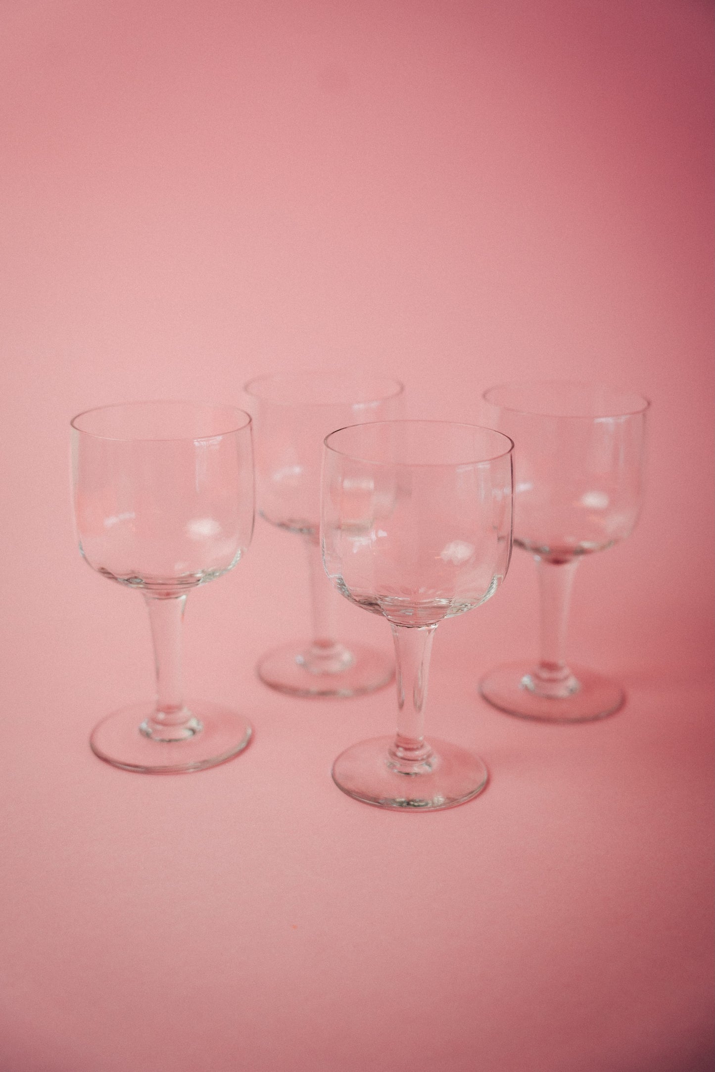 four faceted wineglasses