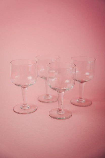 four faceted wineglasses