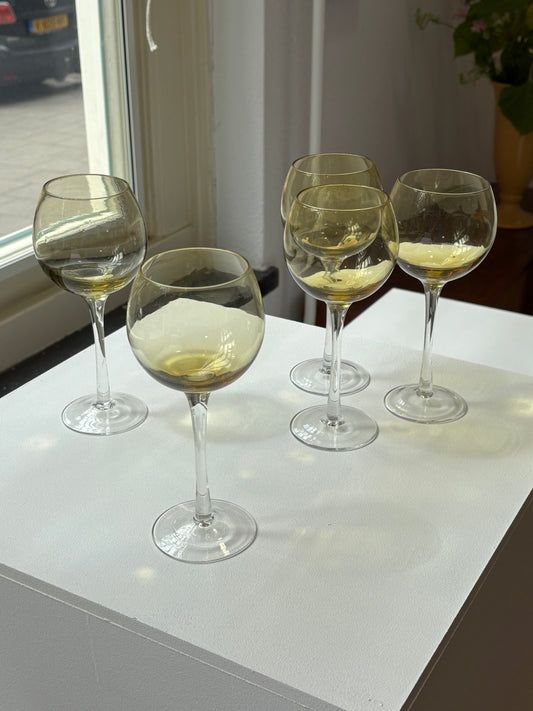 five amber wineglasses