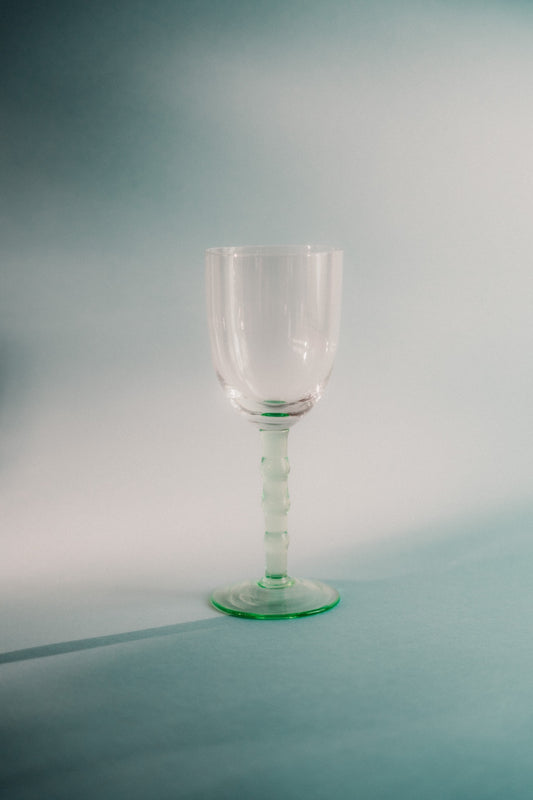 five green wineglasses