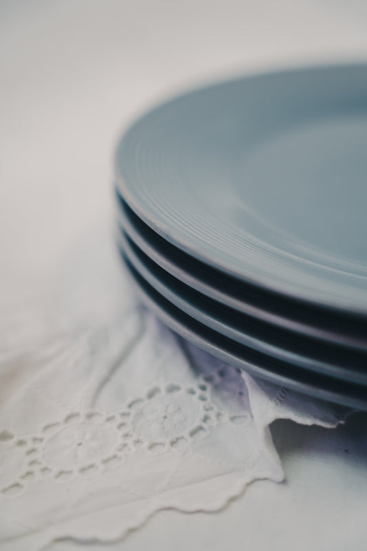 four grey plates