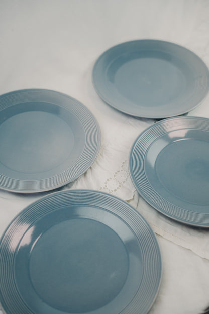 four grey plates